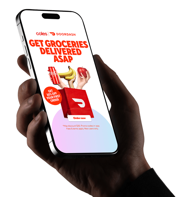 Hand holding a smartphone displaying a grocery delivery promotion campaign