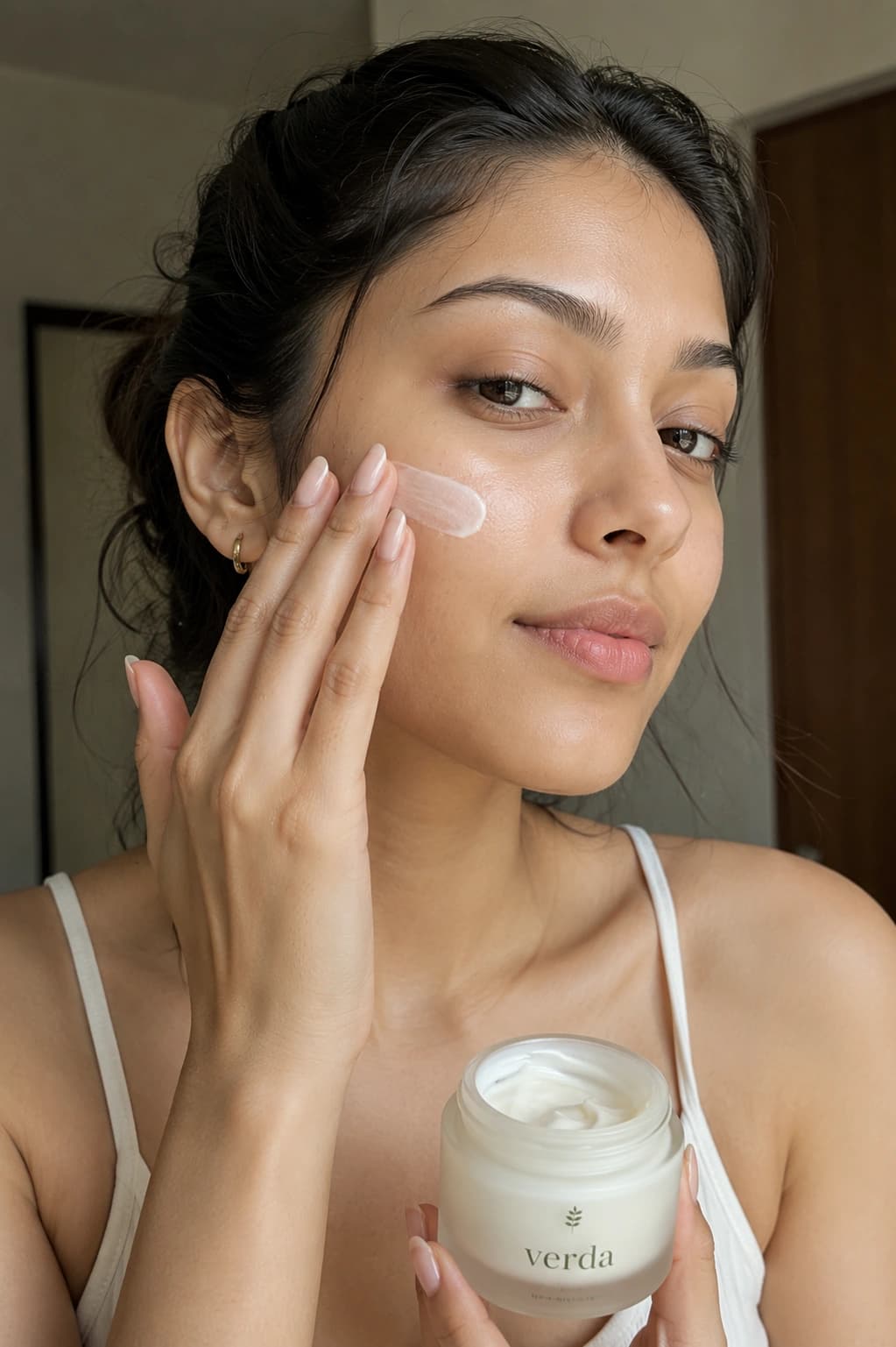 AI-generated UGC-style creator visual of a person applying a branded skincare product in natural light, produced in True North Studio